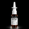 Close-up of a white syringe atop a brown glass bottle; label reads 'Date Night' peptide on a dark background.
