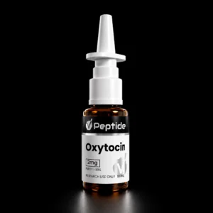 Close-up of a white syringe-like device with an Oxytocin label and amber vial visible below against a black background.
