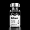 selank Close-up of a glass peptide vial with a silver cap; label shows 'Selank' and '10 mg', purity ≥99%, for research use only.