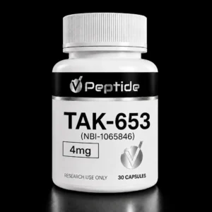 Close-up of a white medicine bottle with a ribbed cap. The label shows TAK-653 (NBI-1065846) and 30 capsules on a black background.